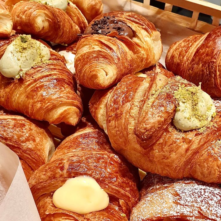 Croissants, plain, chocolate-tipped and pistachio-topped