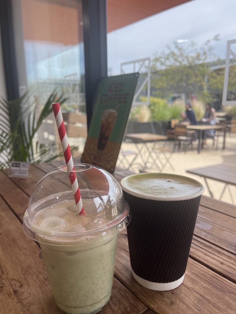 Iced matcha with a striped straw