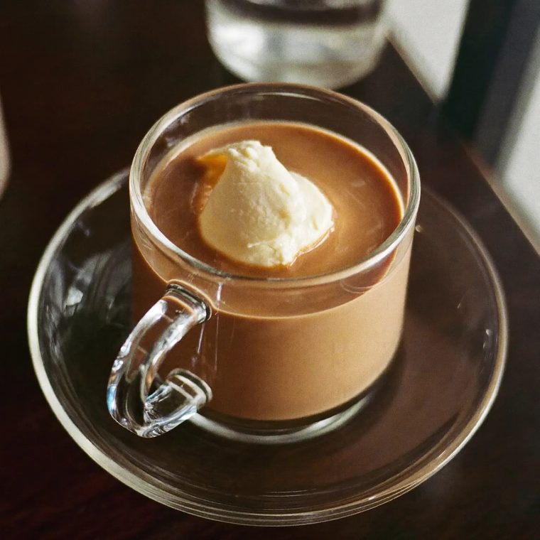 A hot chocolate topped with cream